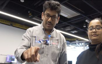 man pointing to small drone